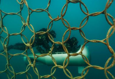 Two divers infant of steel protection under the sea with a submarine as a metaphor of Non-EU scientists face exclusion from sensitive Horizon projects