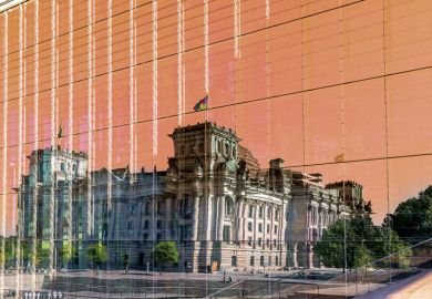 Reichstag building mirrored in glass as a metaphor to plagiarism scandals relating to politicians.