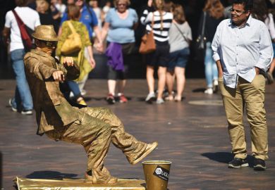 A street artist performs for the public in Sydney A street artist performs for the public in Sydney