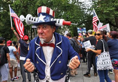 Person dressed as Uncle Sam with Vaccine American hat as metaphor for US partisan divide over Covid splitting apart campuses