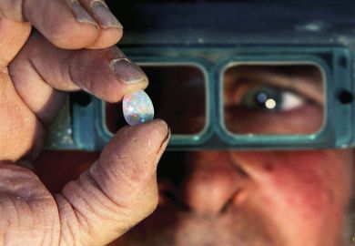  Opal miner holds a finished opal to illustrate Acclaim and anxiety as Australia streamlines funding bids
