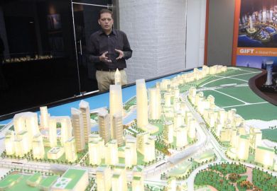 Dipesh Shah, Vice President of GIFT shows a model of GIFT City in Gandhinagar, India Dipesh Shah, Vice President of GIFT shows a model of GIFT City in Gandhinagar, India to illustrate India’s regulation-free city offers blueprint for branch campuses