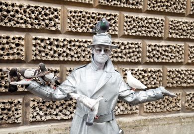 Metallic painted human statue to illustrate ‘Record’ number of UK universities put pay rises on hold