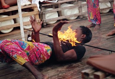 Young man limbo dancing Kenya East Africa  Young man limbo dancing Kenya East Africa Africa to illustrate International scholars ‘in limbo’ awaiting details of UK visa salary rules