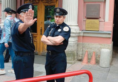 Security officers stand guard outside the US Consulate in Saint Petersburg