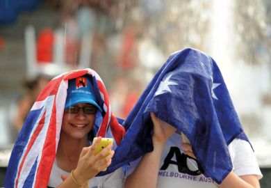 Spectators uses a flag to cover as rain stops play at the Australian Open tennis championship in Melbourne Spectators uses a flag to cover as rain stops play at the Australian Open tennis championship in Melbourne to illustrate delays