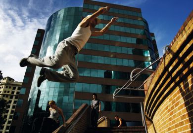 Person exhibits Le Parkour, in Sydney to illustrate New Australian workforce agency to target graduate shortage areas