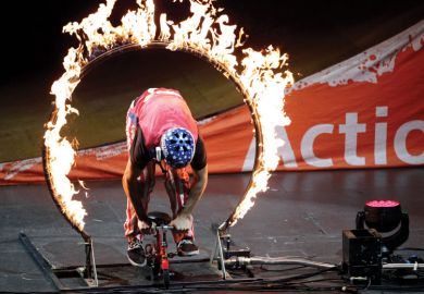 Person behind a fire circle as a metaphor for new regulations while cutting funding ‘callous’