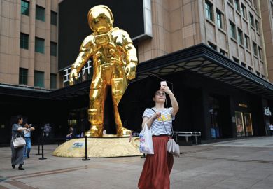 Person taking selfie with an astronaut-installation Person taking selfie with an astronaut-installation as a metaphor for  Prioritise women for research funding, Chinese universities told