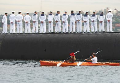 Sailors stand in line with a boat going behind them as a metaphor for Defence research ‘antidote’ to Covid’s lost billions: thinktank