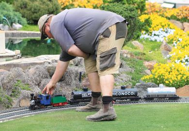 A staff member checks a mini train at Cockington Green Gardens in Canberra, Australia to illustrate Vice-chancellor questions Australia’s embrace of microcredentials