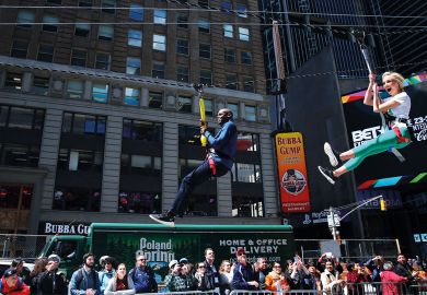 Two people ride a zipline in New York City to illustrate US lawmakers encouraging three-year degree experiments