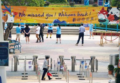 A banner reading 'We missed you! Welcome back!' hangs at the entrance of Hong Kong Ocean Park to illustrate Hong Kong moving beyond pandemic and protests, says v-c