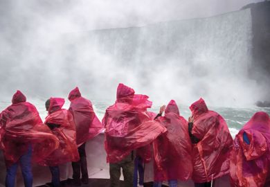 Tourists react to the water spray at at Niagara Falls, Ontario, Canada to illustrate Canada urged to drop English language tests for Nigerian students