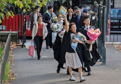 An Asian graduate from Imperial College London holds a Lego aircraft model to illustrate Public wary of growing overseas student numbers as views shift