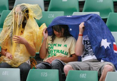 Spectators take temporary cover as rain stops play Spectators take temporary cover as rain stops play to illustrate Government will pilfer international levy proceeds, critics warn