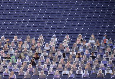 Empty stadium seats are seen with only card board cut outs of fans to illustrate The US has the scope to benefit greatly fro m overseas students