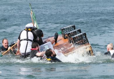 Image of A raft capsizes during a raft race with people falling into the water as a metaphor for Fears for UK research as EU postdoc applications dry up.