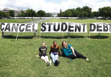 Students with banner reading 'Cancel student debt'  in front of The White House to explain that the Democrats frustrated as Biden stays cautious on higher education