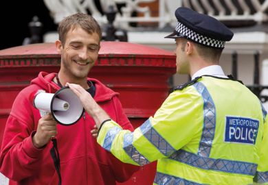 A police officer remonstrates with a protester on a street during a demonstration in London to illustrate Legal action will be a ‘last resort’ as campus free speech bill redrawn