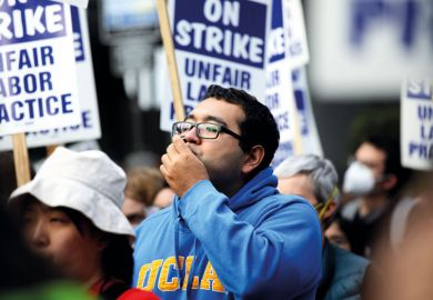 University of California academic workers strike walking the picket line University of California academic workers strike walking the picket line to illustrate California strike presses universities to solve housing dilemma