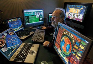 Gambling addict watching multiple casino websites to illustrate Campus casino idea ‘preposterous’