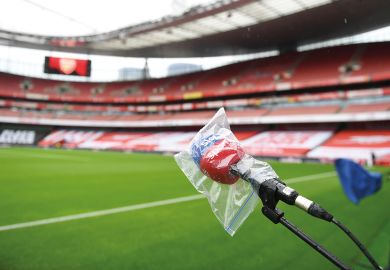  A microphone is covered from the rain pitchside to illustrate University postpones free speech event, over free speech concerns