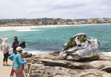 Stainless steel Bag sculpture by artist Yumin Jing at Sydney, Australia to illustrate Disadvantaged students cost ‘six times as much to teach’