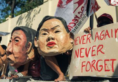 Protesters march to the People Power Monument to commemorate the 36th anniversary of People Power that ousted dictator Ferdinand Marcos Protesters march to the People Power Monument to commemorate the 36th anniversary of People Power that ousted dictator Ferdinand Marcos to illustrate Academics warn against historical revisionism in Philippines