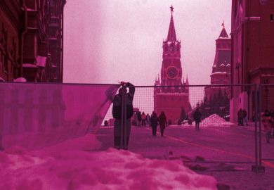 Workers set up a fence at the Red Square Workers set up a fence at the Red Square to illustrate West should not abandon all Russian scholars