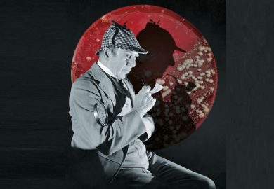 Studio portrait of a man dressed as British detective Sherlock Holmes with a plaid cap, a meerschaum pipe, and a magnifying glass. His silhouette is visible in the background Studio portrait of a man dressed as British detective Sherlock Holmes with a plaid cap, a meerschaum pipe, and a magnifying glass. His silhouette is visible in the background
