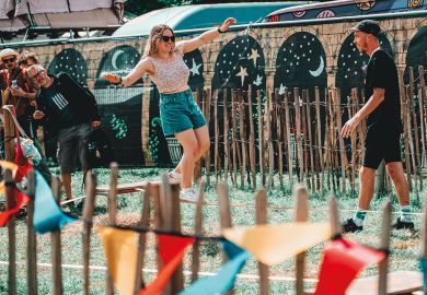  Festival goers walk a tight rope during day two of Glastonbury Festival 2024 to illustrate ‘Uncertainty and volatility’ ahead for UK student housing market