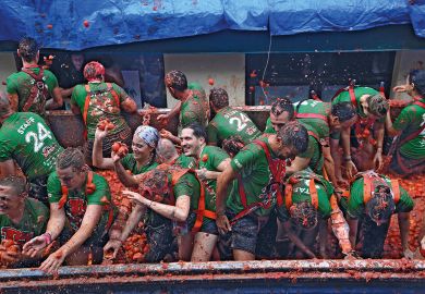 People in a truck throw overriped tomatoes to the street during the "Tomatina" annual food battle in the Spanish eastern town of Bunol to illustrate Admissions algorithm error causes ‘chaos’ for Spanish students