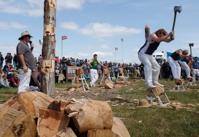 Men compete in a wood chopping competition Deniliquin, Australia  Men compete in a wood chopping competition Deniliquin, Australia to illustrate Immigration risk ratings downgraded at 11 Australian universities