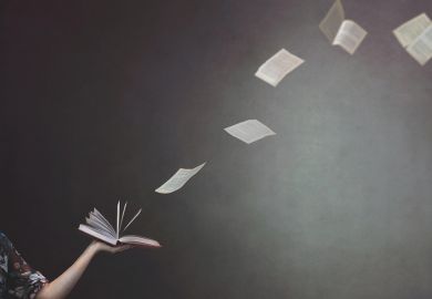 Concept image of pages flying from a book held by a woman Concept of pages flying from a book held by a woman to illustrate REF rules on open access books will have major consequences