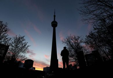 The CN Tower is seen at sunset in Toronto to illustrate Canadian campuses add black student spaces