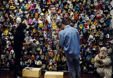 Chinese man camouflaged with painted masks on his body to illustrate What next for US-China research ties post-Lieber?