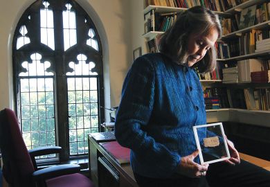 Deceptive text: Karen King with the fragment said to be the Gospel of Jesus’s Wife.The papyrus, now acknowledged as a fabrication Deceptive text: Karen King with the fragment said to be the Gospel of Jesus’s Wife.The papyrus, now acknowledged as a fabrication