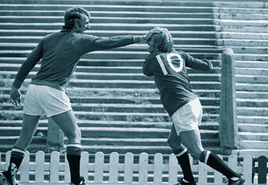 Two footballers play fight to illustrate Interdisciplinarity lacks clout to keep its cash