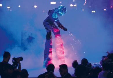 A man in a robot costume performing   A man in a robot costume performing to illustrate ‘ChatGPT-generated reading list’ sparks AI peer review debate