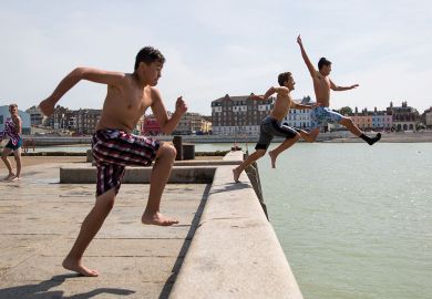 People jump into the North Sea from the Margate Harbour People jump into the North Sea from the Margate Harbour to illustrate Fury at Kent’s plans to cut academics’ time for research