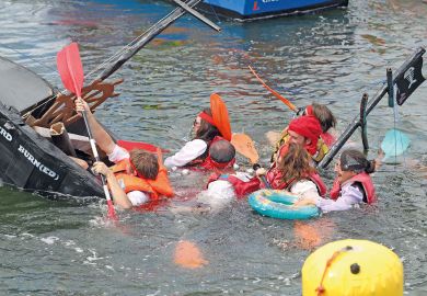 Boat sinking at the Cardboard Boat Regatta at Port-Rhu in Douarnenez, France Boat sinking at the Cardboard Boat Regatta at Port-Rhu in Douarnenez, France to illustrate French funding cuts ‘contradict’ Macron’s research pledge