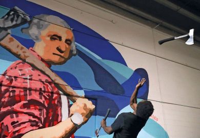 Axe Master Omar Cooper throws a hatchet backwards at a target in Washington, DC to illustrate National Science Foundation set for budget cut