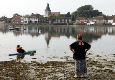 Trapped in the mud, Bosham harbour,  Sussex, UK to illustrate English HE braces for funding review