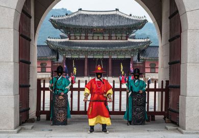 Guards of Gyeongbokgung stand at the closed gates of the palace Guards of Gyeongbokgung stand at the closed gates of the palace to illustrate Korean universities hit with overseas recruitment bans