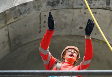 Civil engineer working on a wide concrete tunnel Civil engineer working on a wide concrete tunnel to illustrate Raac closures and disruption ‘worst case scenario’ as term begins