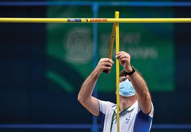 The high jump bar height is adjusted and measured by an official  The high jump bar height is adjusted and measured by an official to illustrate English universities await clarity on impact of GCSE entry bar