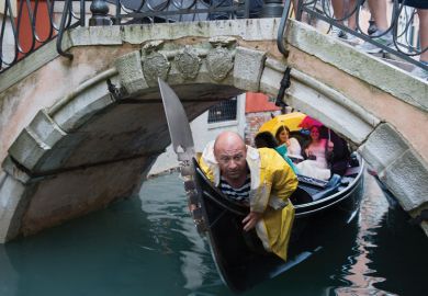 A gondolier crouches down under a bridge A gondolier crouches down under a bridge as a metaphor for long-running campaign by foreign university staff in Italy to gain equal pay and conditions to their local counterparts