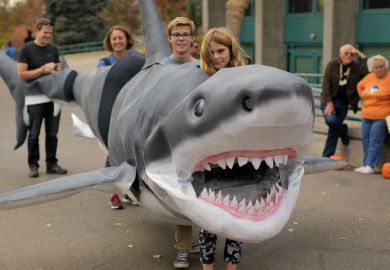People inside a shark costume