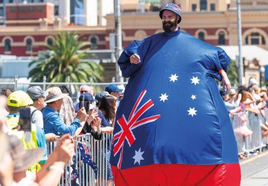 Man in inflated costume with an Australian flag Man in inflated costume with an Australian flag to illustrate Some Australian campuses ‘earn more from locals than foreigners’